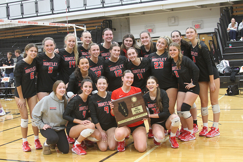 Huntley's volleyball team celebrates after winning the McHenry IHSA Class 4A sectional championship. Huntley downed Libertyville, 25-16, 25-23 to advance to the DeKalb super-sectional.