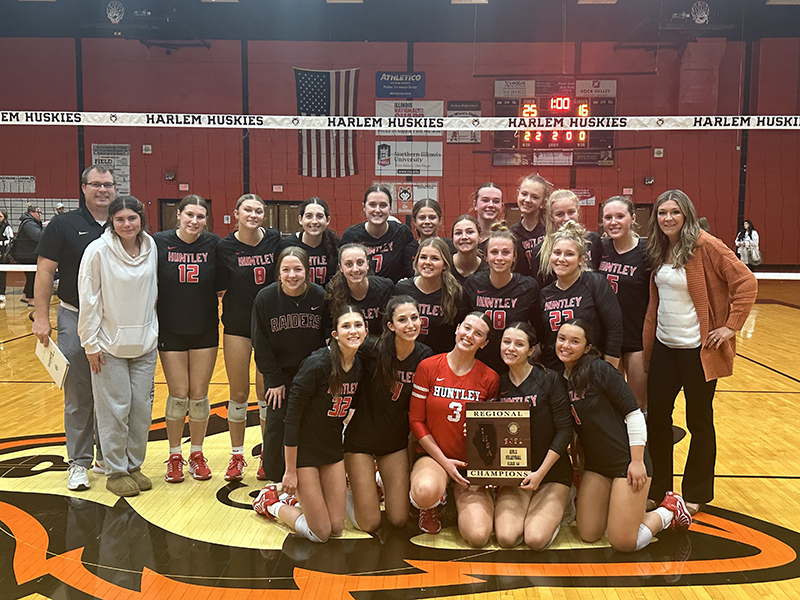 Huntley's girls volleyball squad celebrates after winning the Machesney Park Harlem regional title over Rockford Guilford.