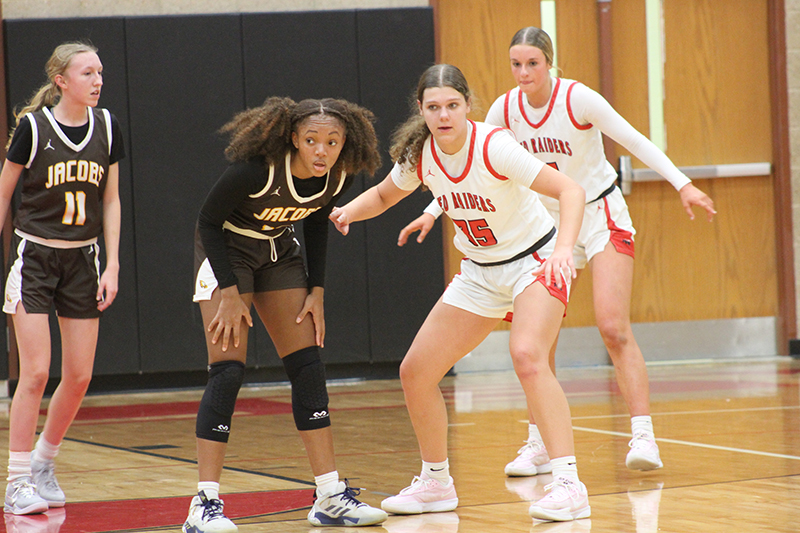 Huntley's Paula Strzelecki, left and Anna Campanelli play defense against Jacobs in the Red Raiders' 61-16 Fox Valley Conference win Dec. 10.