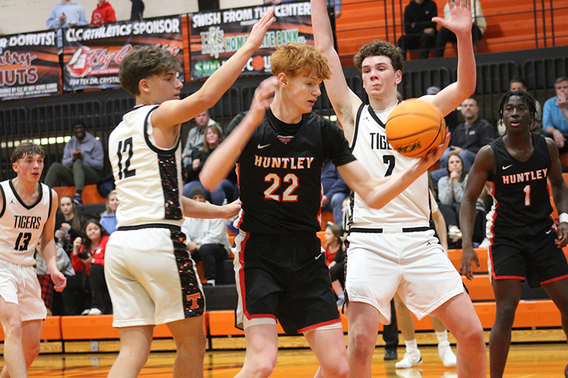 Huntley senior Logan Darragh (22) goes up for two points against Crystal Lake Central.