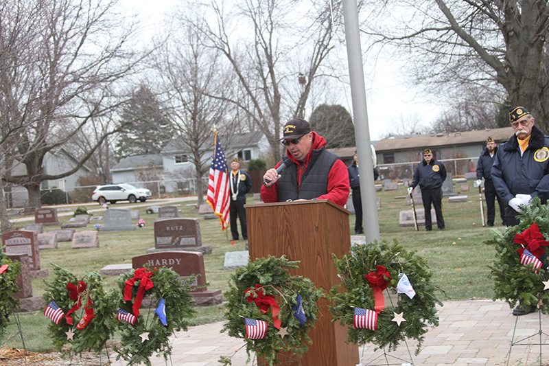 Huntley Village Trustee JR Westberg addresses the audience at the Wreaths Across America event at Huntley Cemetery Dec. 14.