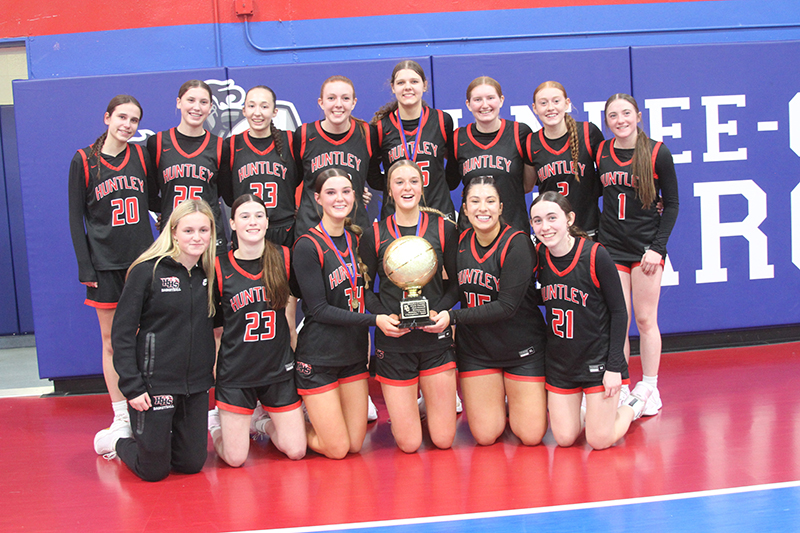 Huntley girls basketball team celebrates after winning the Dundee-Crown Komaromy Classic tournament.