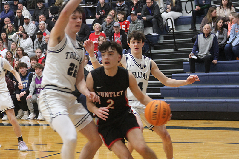 Huntley senior Christian Wilson heads to the basket against Cary-Grove. The Red Raiders beat the Trojans 58-52 Jan. 24.