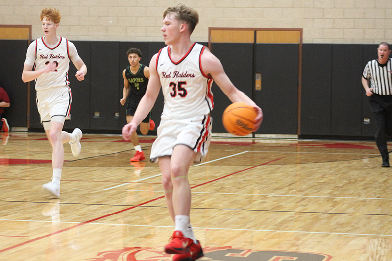 Huntley senior Will Dillon starts a play. Dillon scored 17 points in the Red Raiders' 39-34 win over Dundee-Crown Feb. 14.