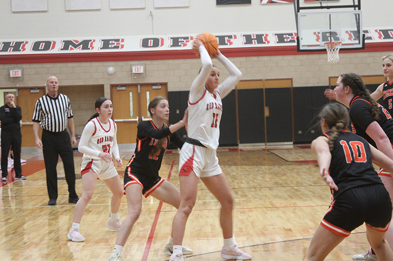 Huntley senior Anna Campanelli looks for an open teammate against Crystal Lake Central. Luca Garlin looks on.