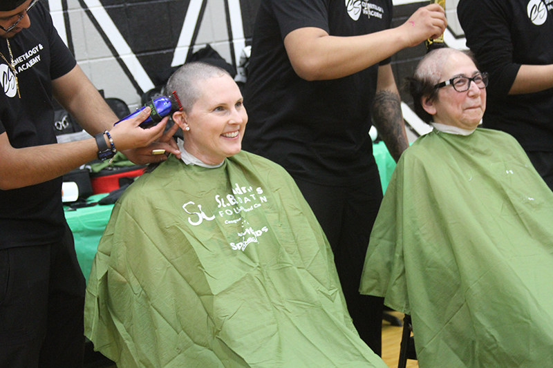 Cindy Fitzgerald, left and Jeannie Apilan, were among the participants who got their heads shaved at the St. Baldrick's Foundation's “Battle of the Bald” event Feb. 28 at Marlowe Middle School.